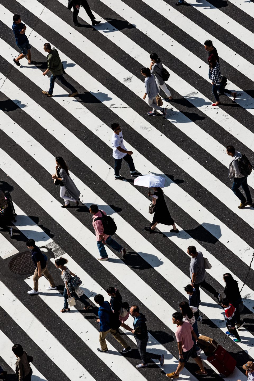 People walking through a crosswalk