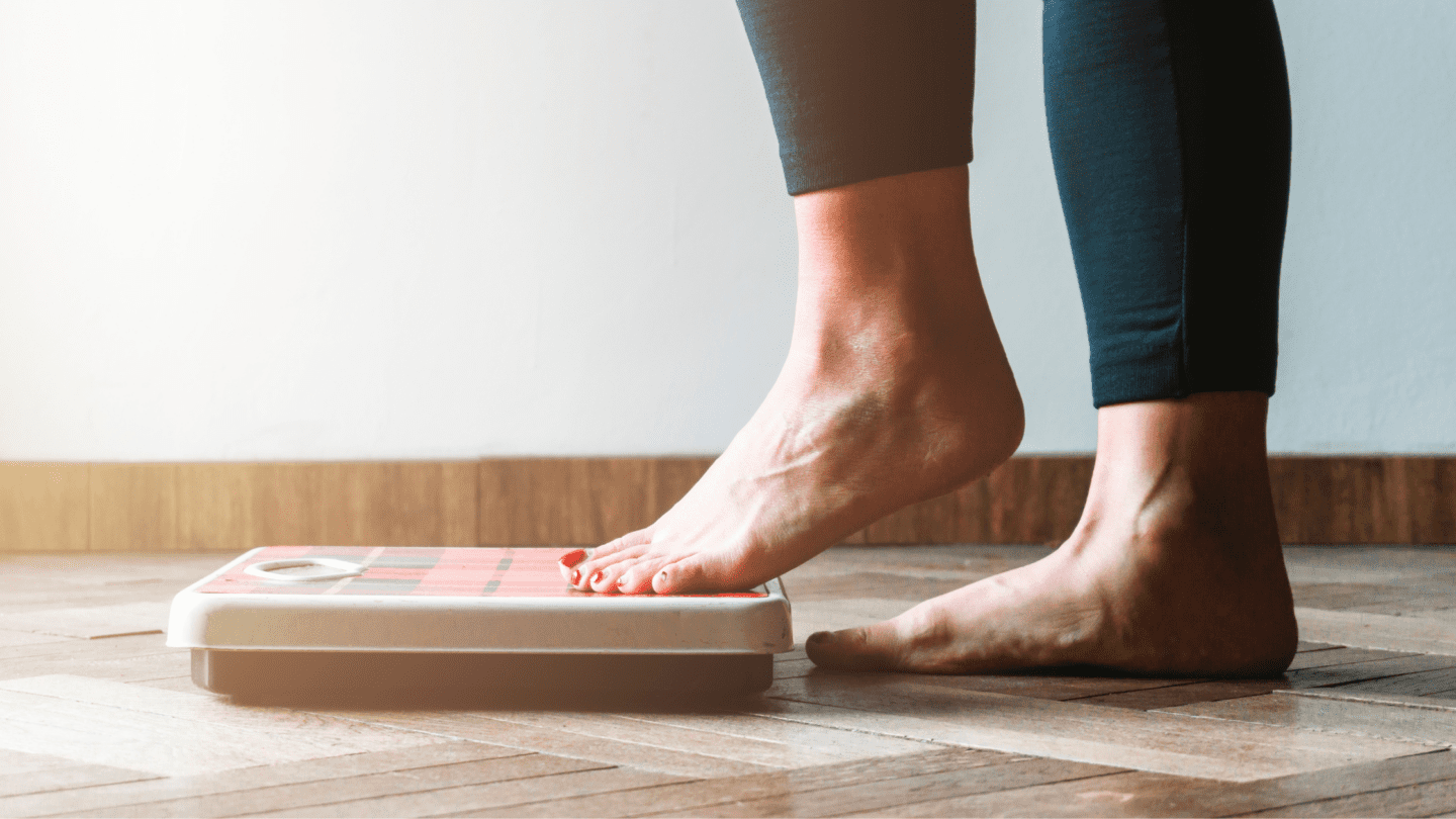 Person stepping on scale